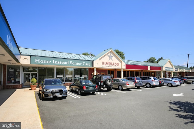 view of building exterior featuring uncovered parking