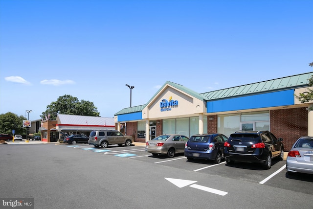 view of property featuring uncovered parking