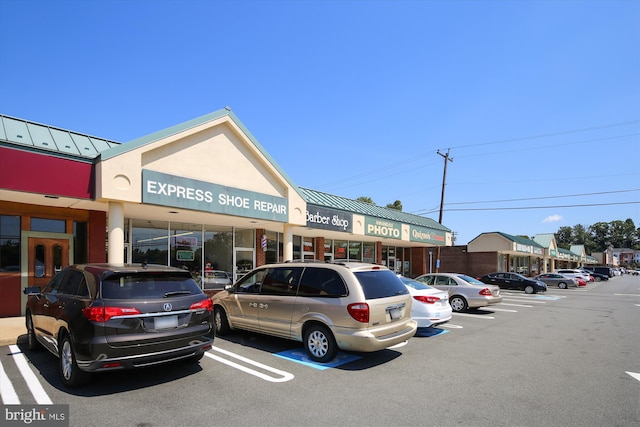 view of property featuring uncovered parking