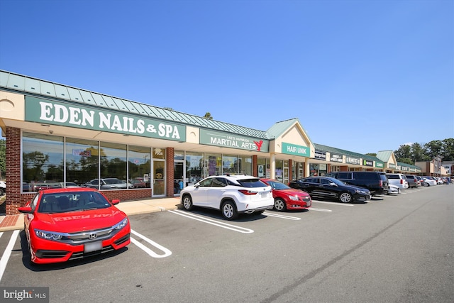 view of property with uncovered parking