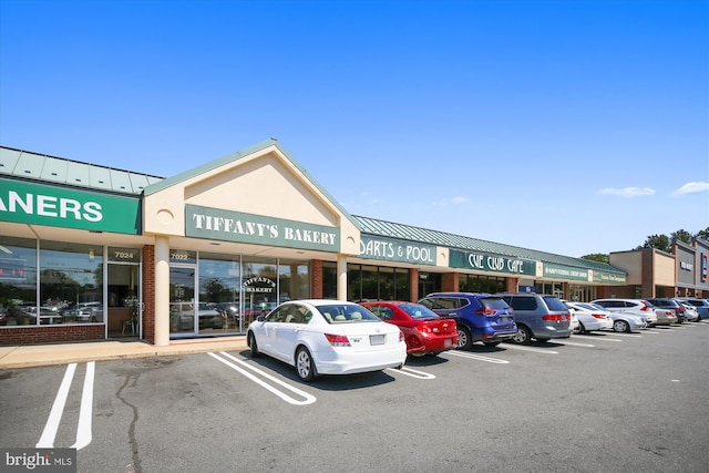 view of building exterior featuring uncovered parking