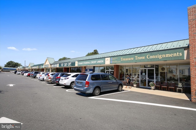 view of property featuring uncovered parking