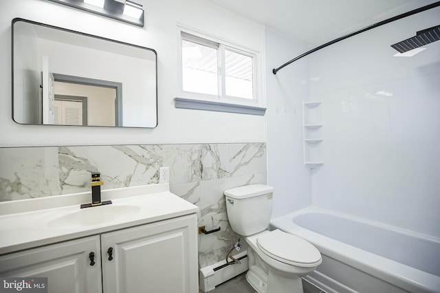 full bath with tile walls, washtub / shower combination, toilet, baseboard heating, and vanity