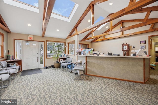 interior space with a skylight, carpet flooring, recessed lighting, and beamed ceiling