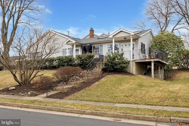 single story home with a chimney and a front lawn