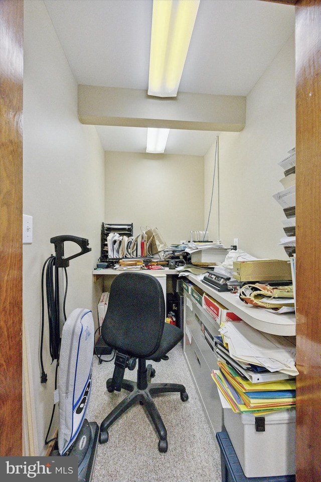 office featuring beam ceiling