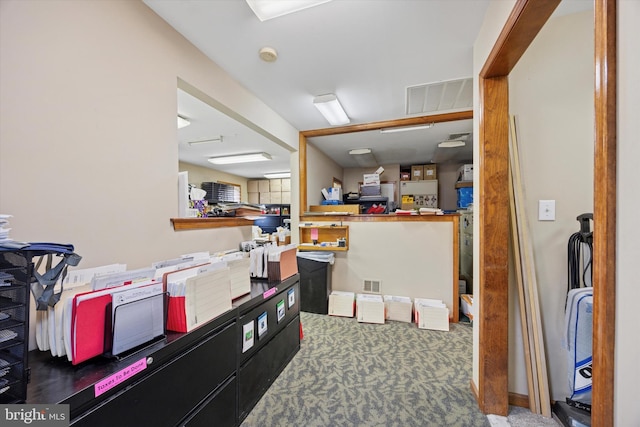 carpeted office space featuring visible vents