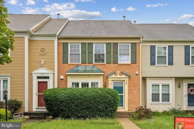 multi unit property with brick siding and entry steps