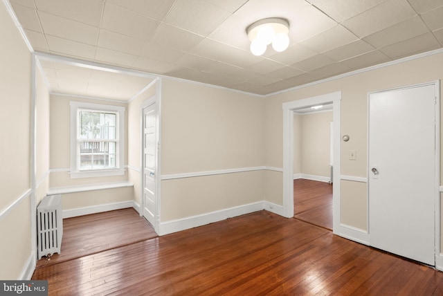 2621 2nd Rd N, Arlington, VA 22201 - spare room with radiator heating unit, crown molding, and wood-type flooring