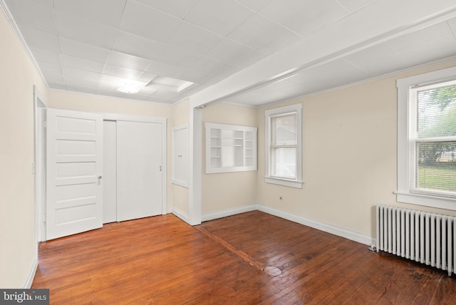 2621 2nd Rd N, Arlington, VA 22201 - spare room with wood-type flooring, ornamental molding, baseboards, and radiator