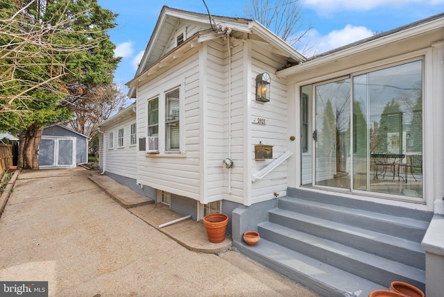 2621 2nd Rd N, Arlington, VA 22201 - exterior space featuring a shed, an outdoor structure, entry steps, a patio, and a garage