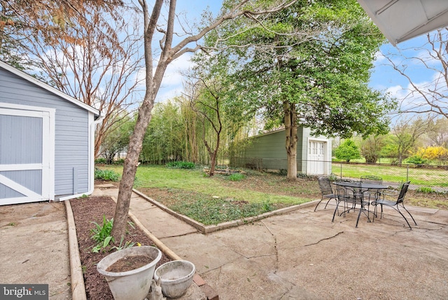 2621 2nd Rd N, Arlington, VA 22201 - view of yard featuring an outbuilding, fence, outdoor dining space, a patio area, and a storage shed