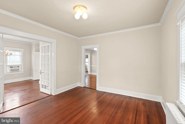 2621 2nd Rd N, Arlington, VA 22201 - unfurnished room with dark wood-style floors, crown molding, radiator heating unit, and a chandelier