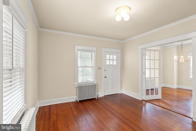 2621 2nd Rd N, Arlington, VA 22201 - foyer entrance with crown molding, wood finished floors, radiator heating unit, and an inviting chandelier