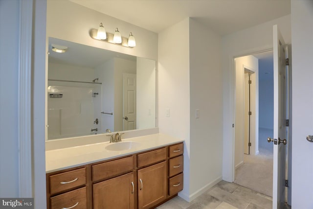 full bathroom featuring vanity and baseboards