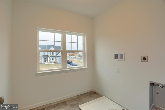 laundry area with electric dryer hookup, baseboards, washer hookup, and laundry area