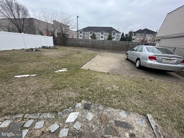 view of yard with a residential view and fence private yard