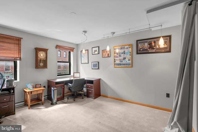 office area with baseboards, carpet floors, and baseboard heating
