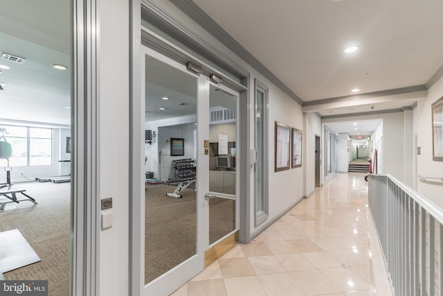 corridor featuring visible vents, baseboards, ornamental molding, recessed lighting, and light tile patterned flooring