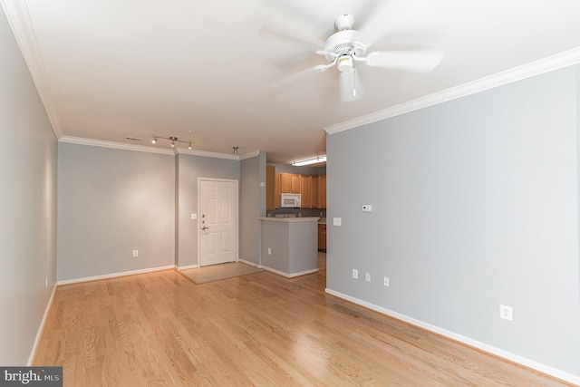 unfurnished living room featuring baseboards, light wood-style floors, ornamental molding, and a ceiling fan