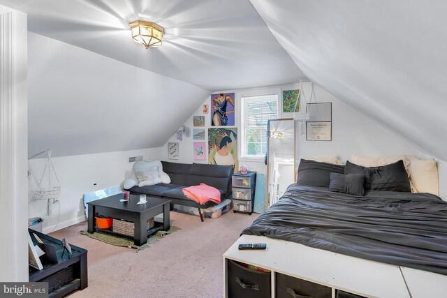 bedroom featuring carpet flooring and lofted ceiling