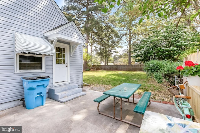 view of patio with entry steps and a fenced backyard