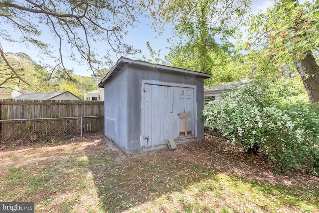 view of shed with fence