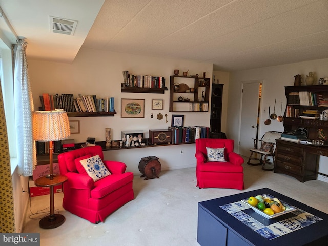 living area featuring visible vents