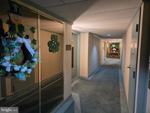 corridor featuring a paneled ceiling