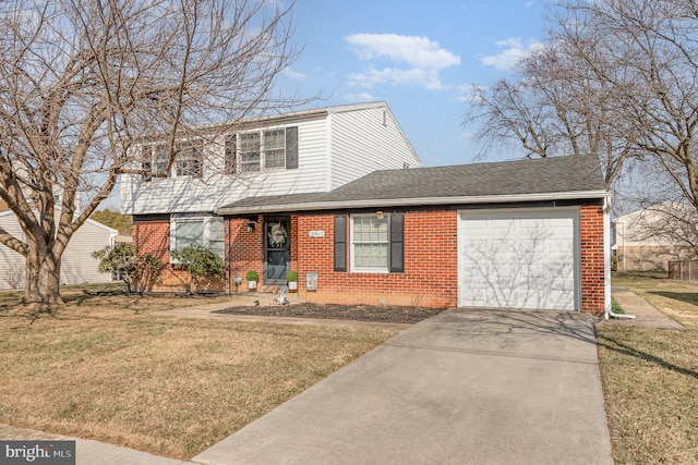 view of front of house featuring a front lawn, brick siding, and a garage