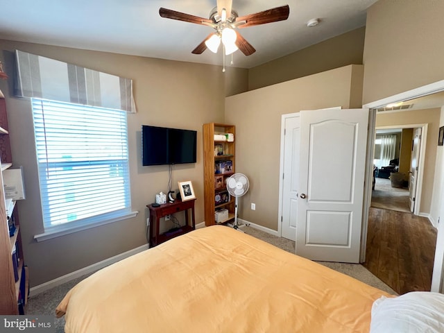 bedroom with baseboards and a ceiling fan