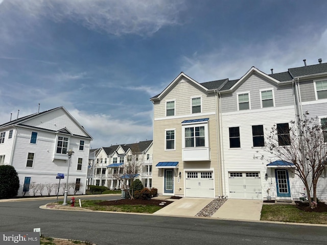 322 Shipyard Dr Unit 82, Cambridge, MD 21613 - multi unit property featuring concrete driveway, a garage, and a residential view