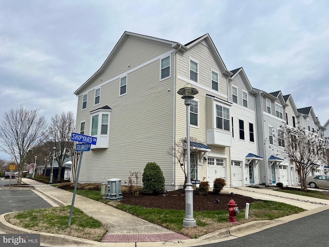 322 Shipyard Dr Unit 82, Cambridge, MD 21613 - view of side of home with cooling unit and a residential view