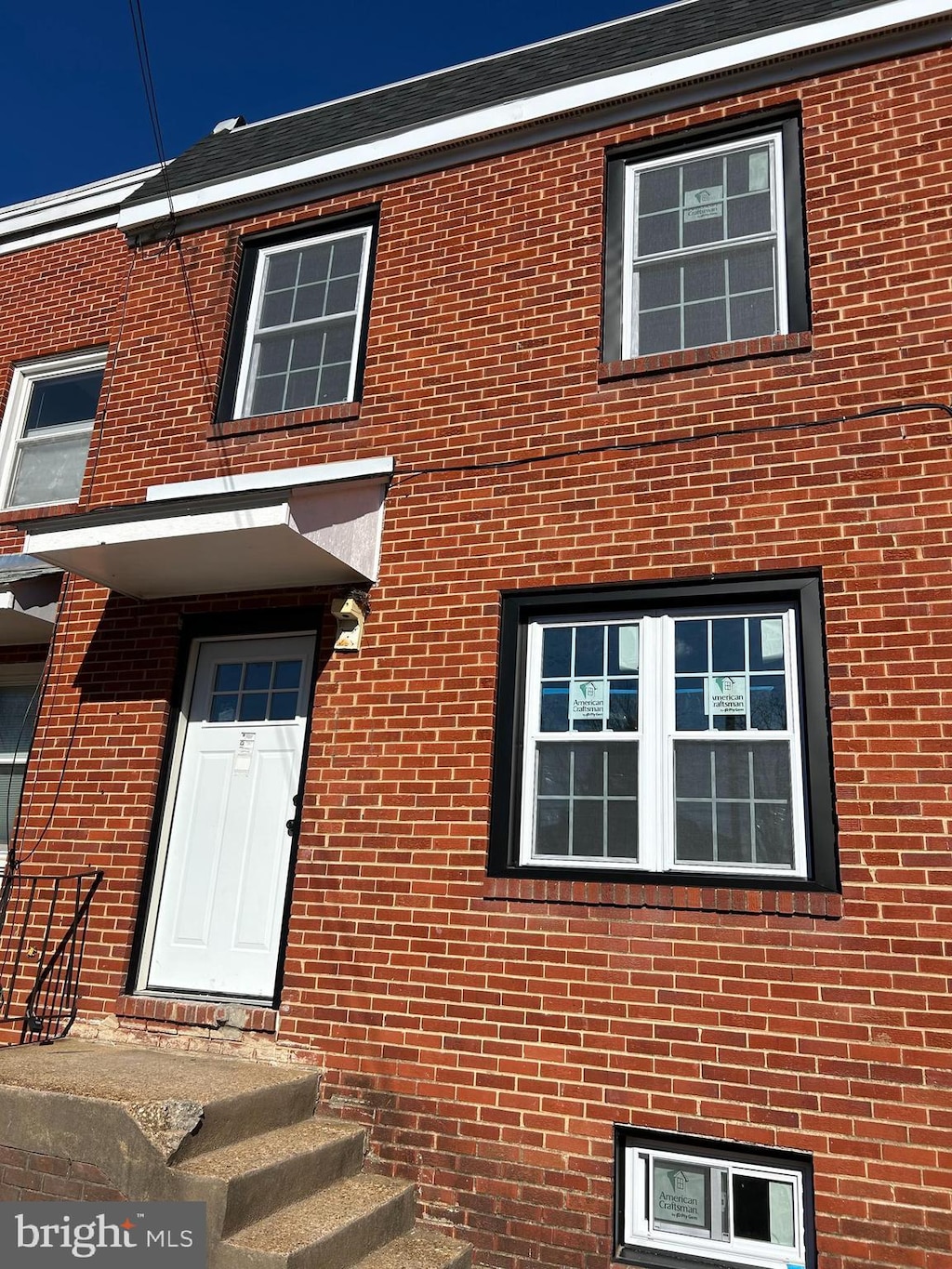 property entrance with brick siding