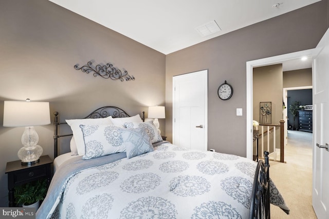 bedroom with light colored carpet