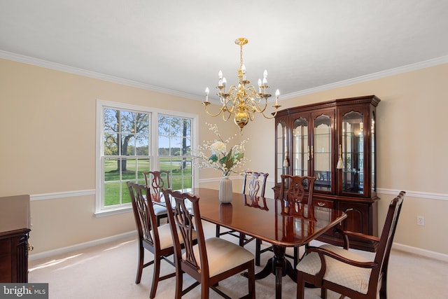 dining room with a chandelier, crown molding, light colored carpet, and baseboards