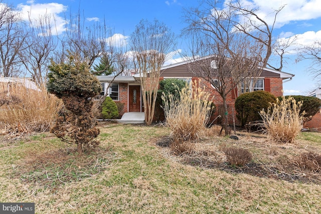 ranch-style house with brick siding