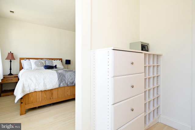 bedroom with wood finished floors