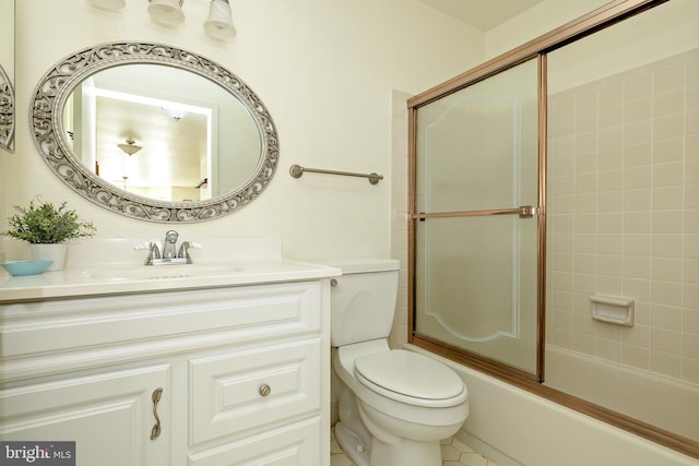 bathroom with shower / bath combination with glass door, toilet, and vanity