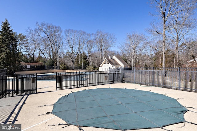 view of swimming pool with a fenced in pool, a patio, and fence