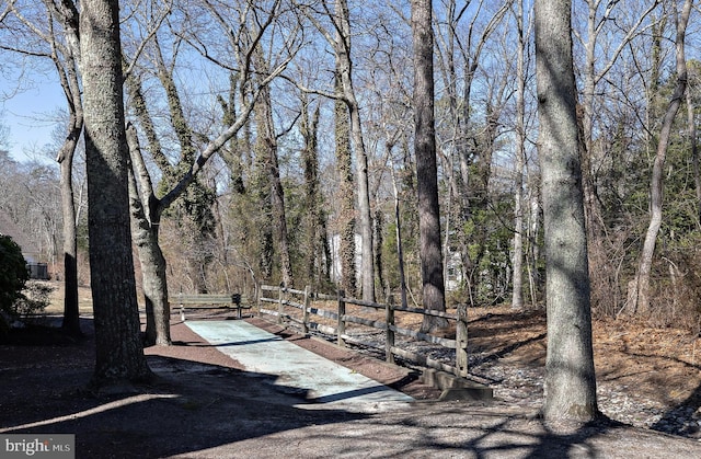 view of community with a forest view