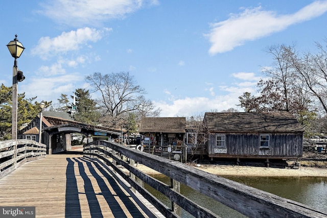 exterior space featuring a detached carport and a water view