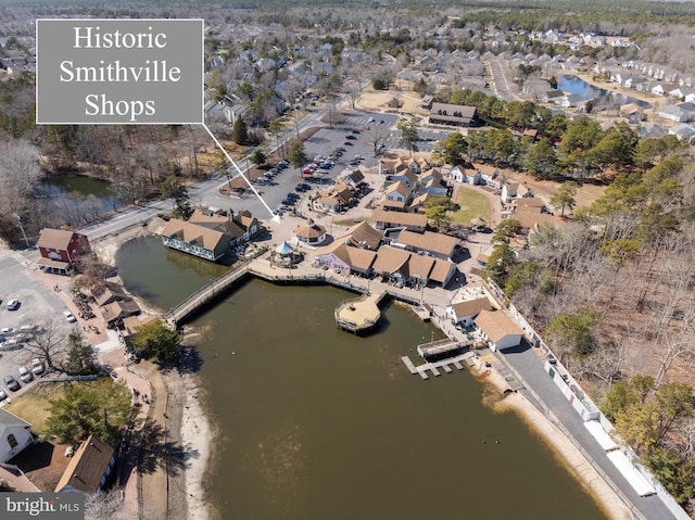 birds eye view of property featuring a residential view and a water view