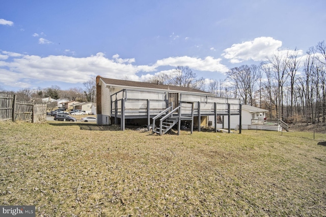 view of outbuilding featuring fence