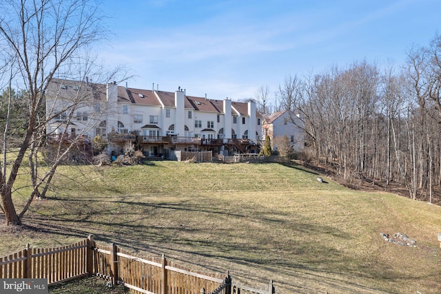 view of yard featuring a deck and fence