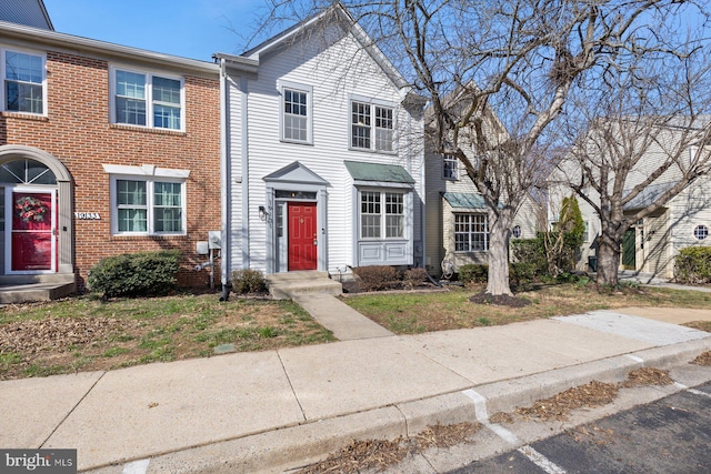 multi unit property featuring brick siding