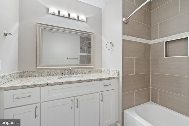 bathroom with vanity and bathtub / shower combination