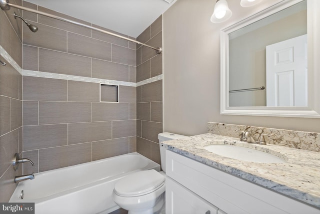 full bath featuring vanity, shower / tub combination, and toilet