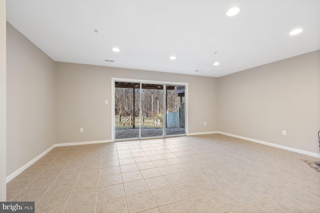 unfurnished room with light tile patterned flooring, recessed lighting, and baseboards