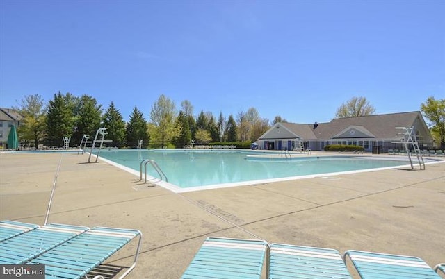 community pool featuring a patio area